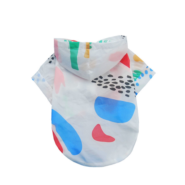 Happy dog showing off its UV protection shirt