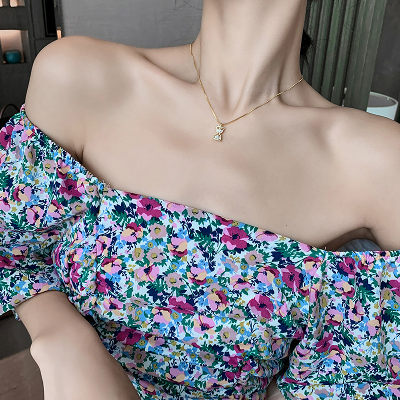 Close-up of Hourglass Pendant