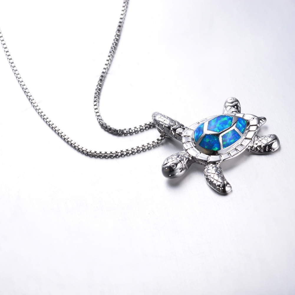 Close-up of turtle necklace