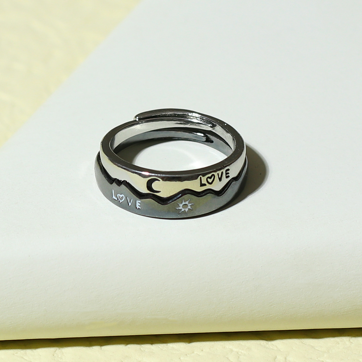 LOVE Sun Moon Star Couple Ring on display