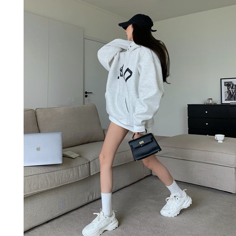 Casual Women's Loose Printed Hooded Sweatshirt in action