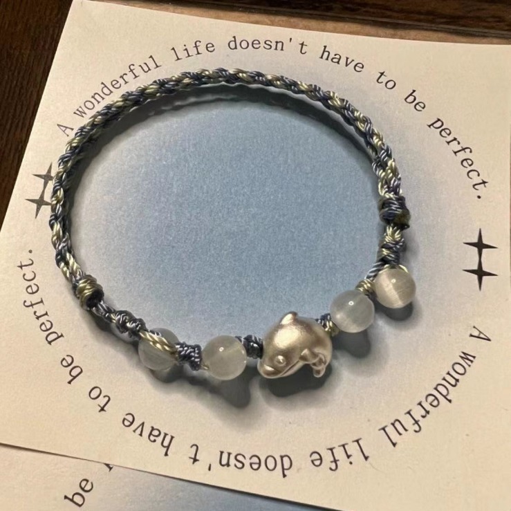 Elegant Silver Dolphin Bracelet on display