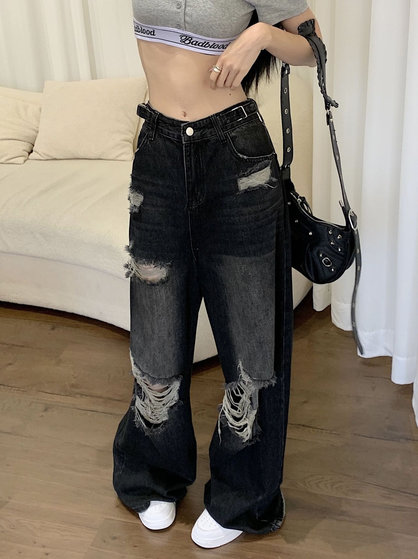 Side View of Black Ripped Jeans