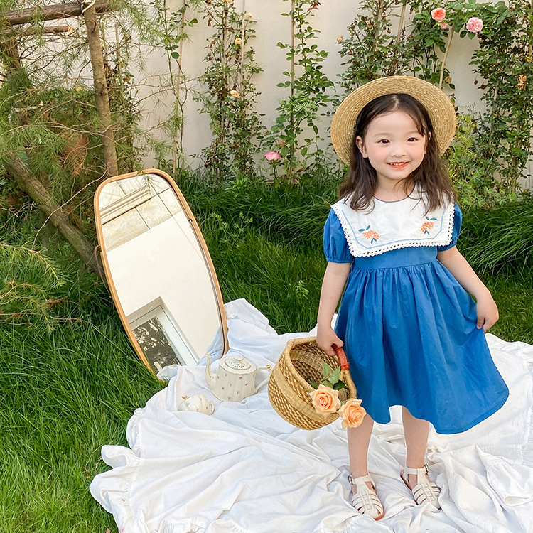 Navy embroidered floral dress on model