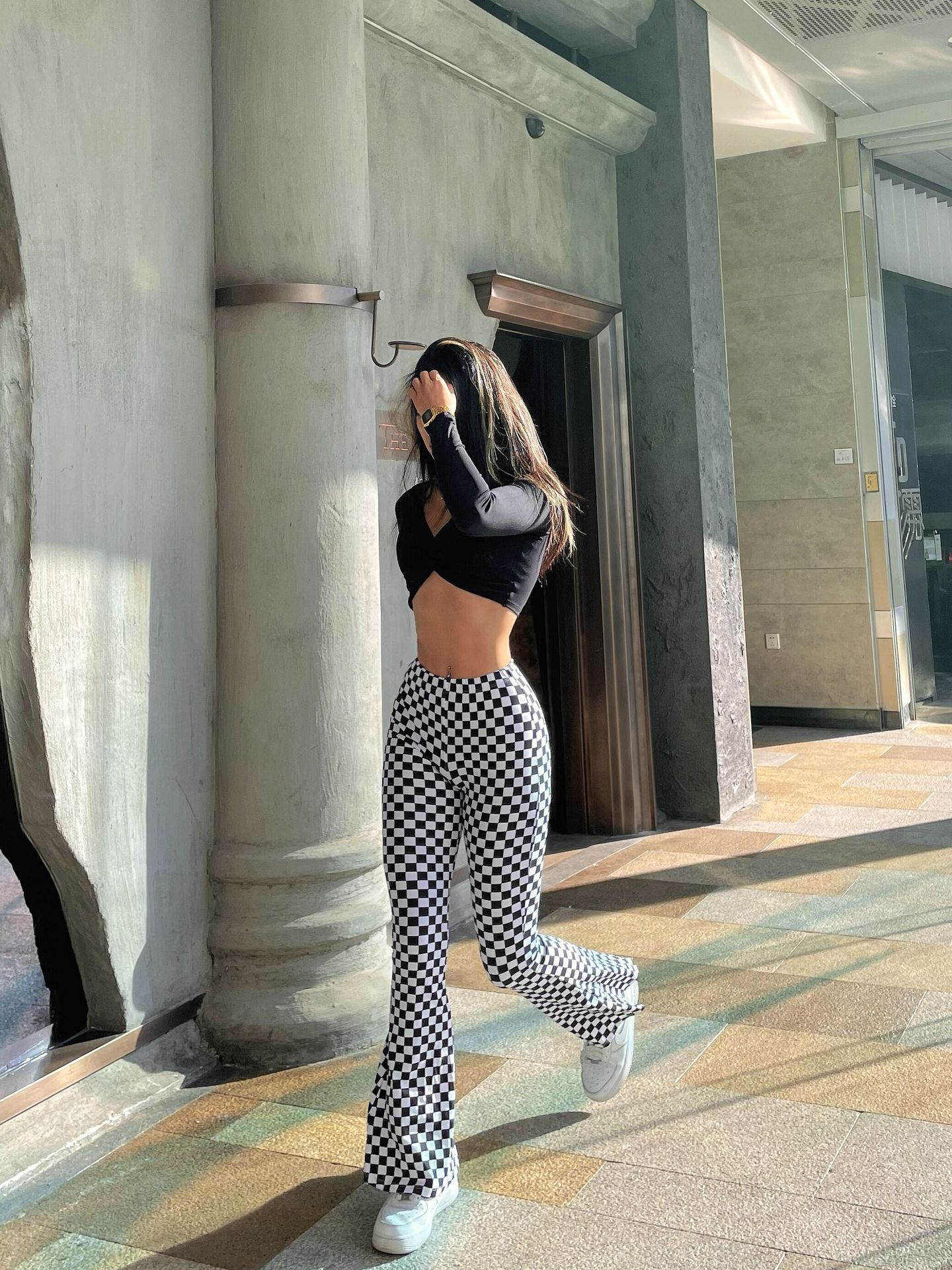 Model wearing Chessboard Plaid Bell-bottom Pants