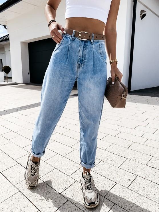 High-rise washed jeans on model